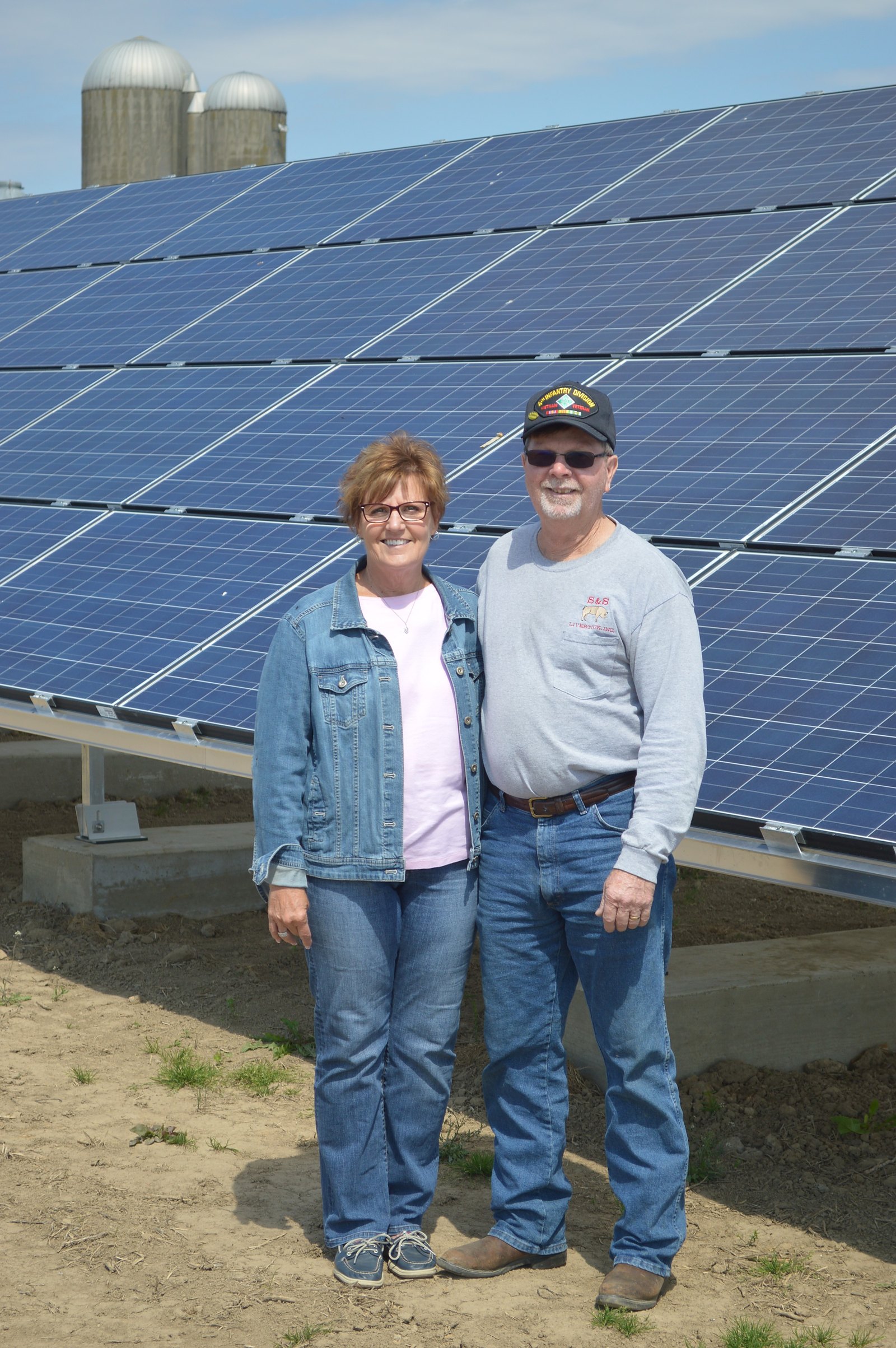 ecojiva customers at their farm solar installation