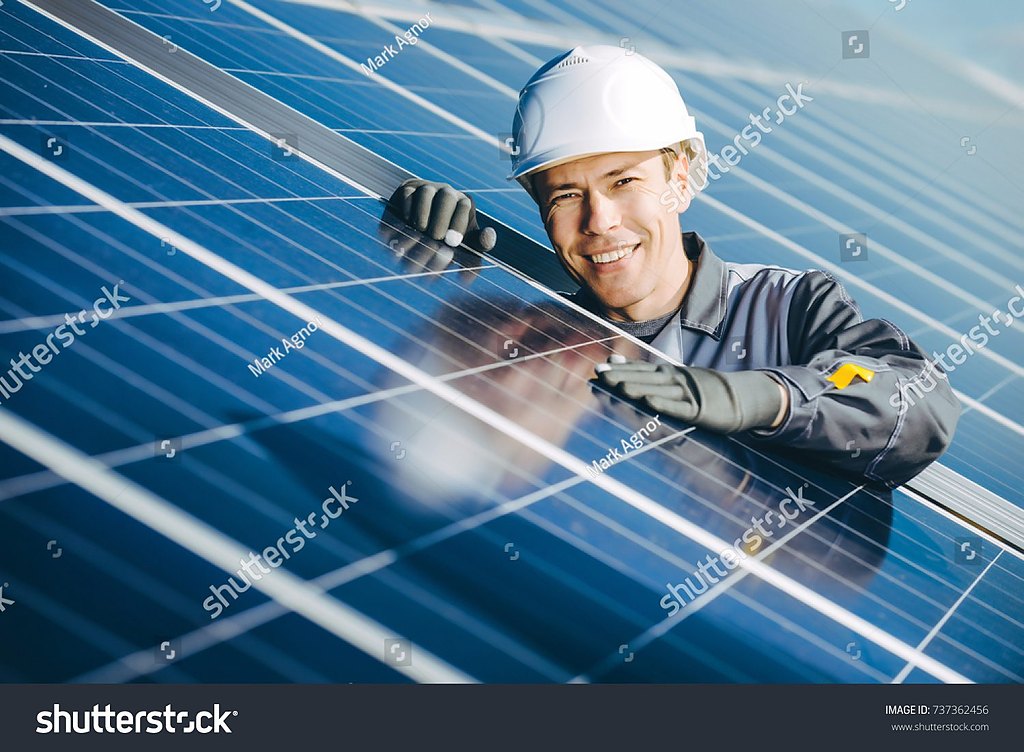 Engineer inspecting a rooftop solar array