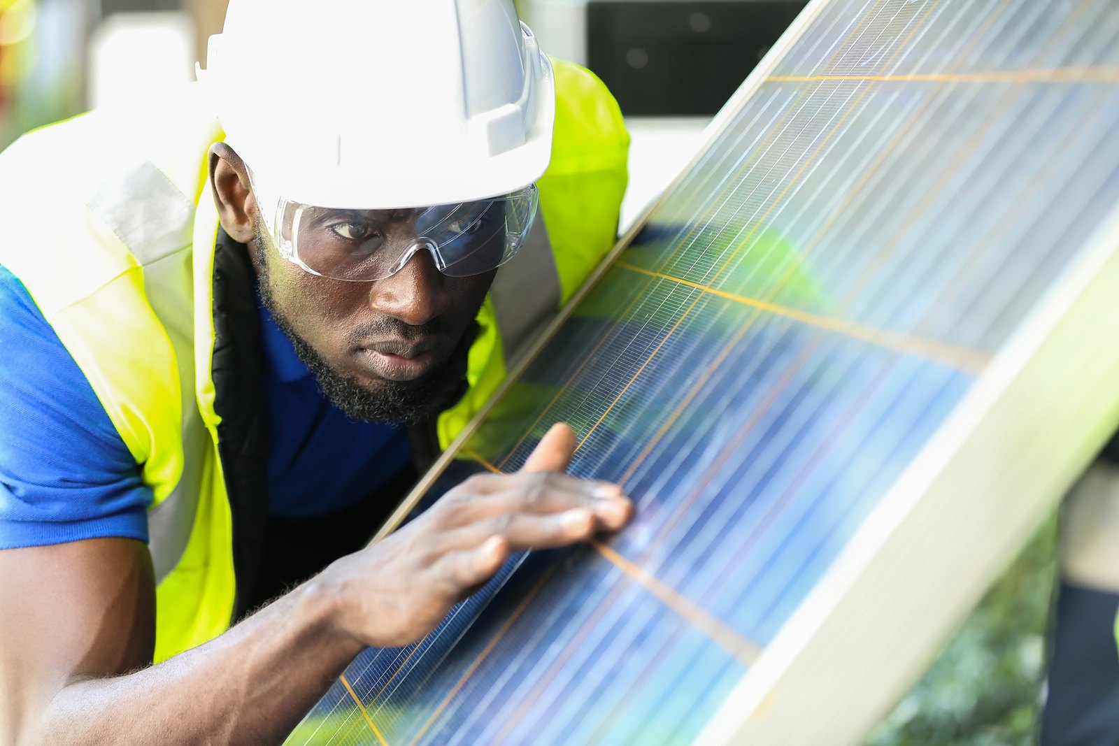 ecojiva installer setting a rooftop solar module